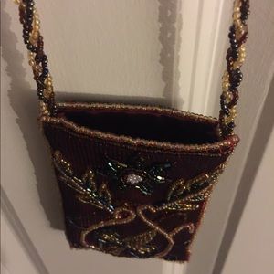 Crossbody money/accessory holder.